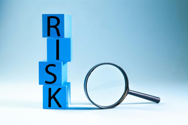 Risk blocks with a magnifying glass